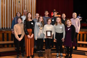 The winning team with their award